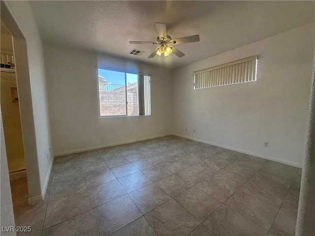 8042 Palace Monaco Ave, Las Vegas, NV 89117 - empty room featuring a ceiling fan, tile patterned flooring, and a textured ceiling