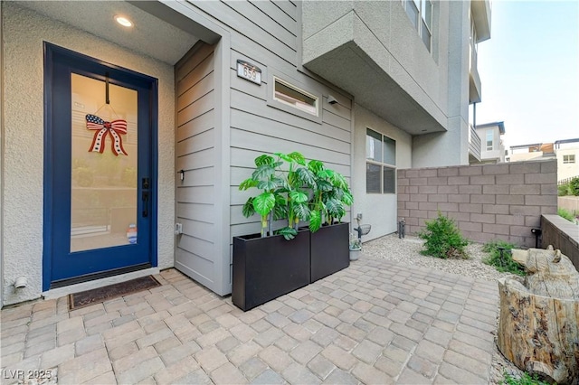 659 Spotted Falcon St, Las Vegas, NV 89138 - view of exterior entry featuring a patio
