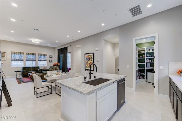 659 Spotted Falcon St, Las Vegas, NV 89138 - kitchen with open floor plan, recessed lighting, stainless steel dishwasher, white cabinetry, and a center island with sink