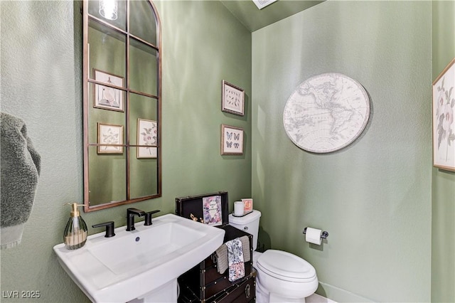 659 Spotted Falcon St, Las Vegas, NV 89138 - half bathroom featuring a sink and toilet