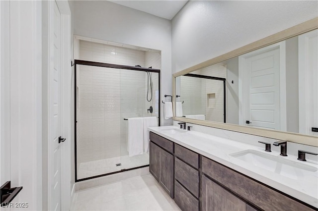 659 Spotted Falcon St, Las Vegas, NV 89138 - bathroom with a shower stall, double vanity, and tile patterned flooring