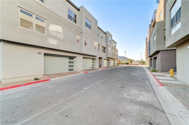 659 Spotted Falcon St, Las Vegas, NV 89138 - view of asphalt street featuring curbs, sidewalks, and a residential view