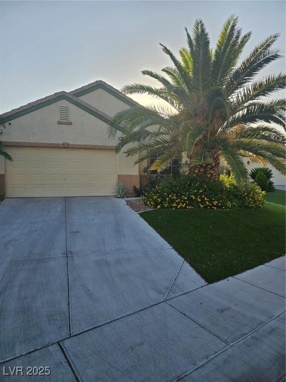 5717 Blizzard Breeze St, North Las Vegas, NV 89081 - view of front of house featuring driveway and a garage