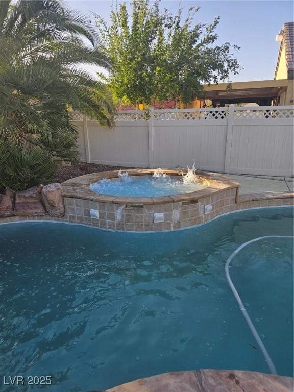 5717 Blizzard Breeze St, North Las Vegas, NV 89081 - view of pool with a jacuzzi