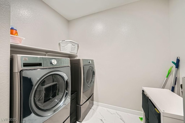 6834 Compass St, North Las Vegas, NV 89084 - laundry area featuring washer and clothes dryer and light marble finish floors