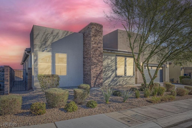 6834 Compass St, North Las Vegas, NV 89084 - view of front of house with a garage and a gate