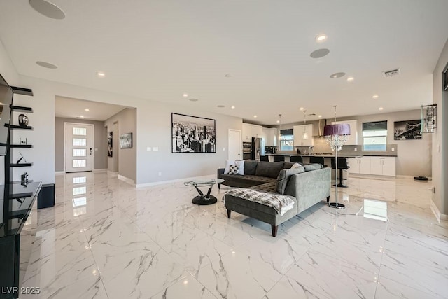 6834 Compass St, North Las Vegas, NV 89084 - living room featuring recessed lighting and light marble finish floors