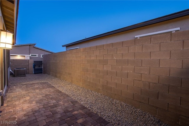909 Allister Fields Ln, Las Vegas, NV 89138 - view of home's exterior with a patio area and a gate