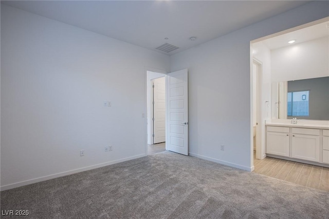 909 Allister Fields Ln, Las Vegas, NV 89138 - unfurnished bedroom featuring light carpet and connected bathroom
