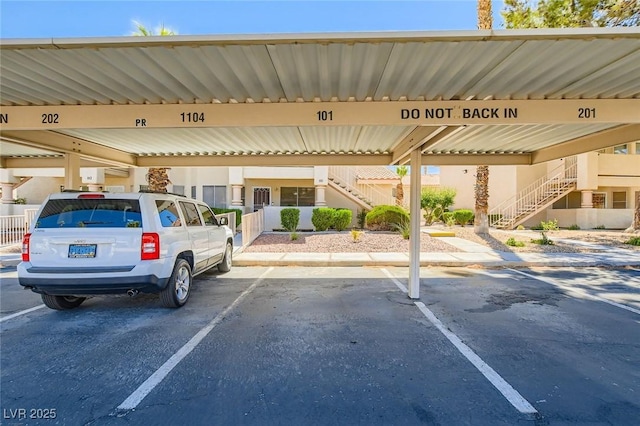 1104 Pinto Rock Ln Unit 101, Las Vegas, NV 89128 - covered parking lot with stairway