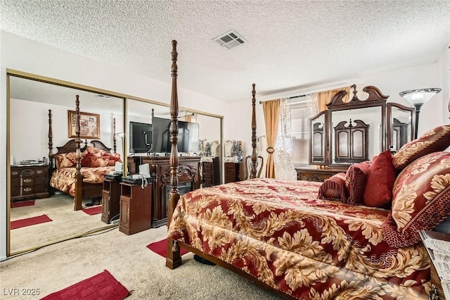 1104 Pinto Rock Ln Unit 101, Las Vegas, NV 89128 - bedroom featuring carpet flooring and a textured ceiling