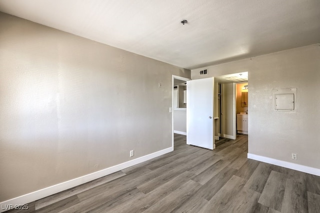 1381 E University Ave Unit 204, Las Vegas, NV 89119 - empty room with wood finished floors and a pendent fire sprinkler