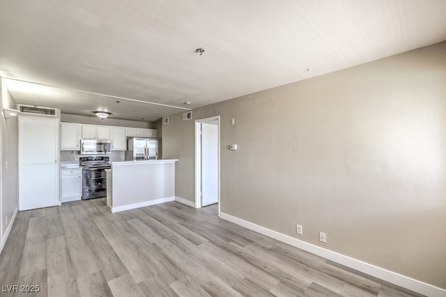 1381 E University Ave Unit 204, Las Vegas, NV 89119 - kitchen featuring stainless steel appliances, white cabinets, light wood-style floors, light countertops, and open floor plan