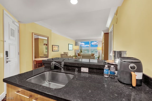 2000 N Fashion Show Dr Unit 2222, Las Vegas, NV 89109 - kitchen with dark stone countertops and open floor plan