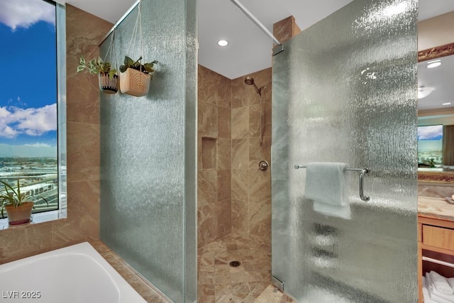 2000 N Fashion Show Dr Unit 2222, Las Vegas, NV 89109 - full bath featuring a stall shower, a bath, tile walls, and recessed lighting