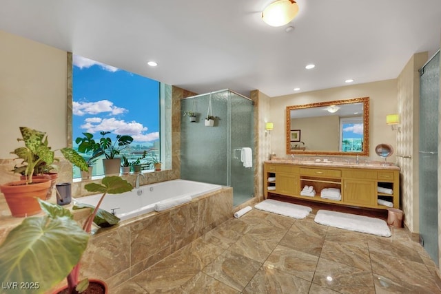 2000 N Fashion Show Dr Unit 2222, Las Vegas, NV 89109 - bathroom with vanity, a stall shower, a garden tub, and recessed lighting