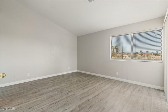5038 S Rainbow Blvd Unit 206, Las Vegas, NV 89118 - unfurnished room with wood finished floors and lofted ceiling