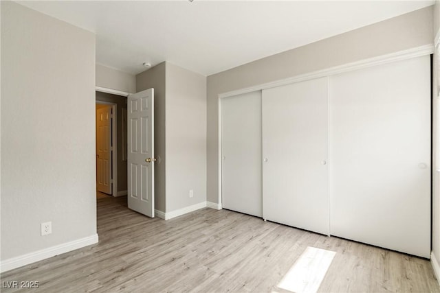 5038 S Rainbow Blvd Unit 206, Las Vegas, NV 89118 - unfurnished bedroom featuring wood finished floors and a closet