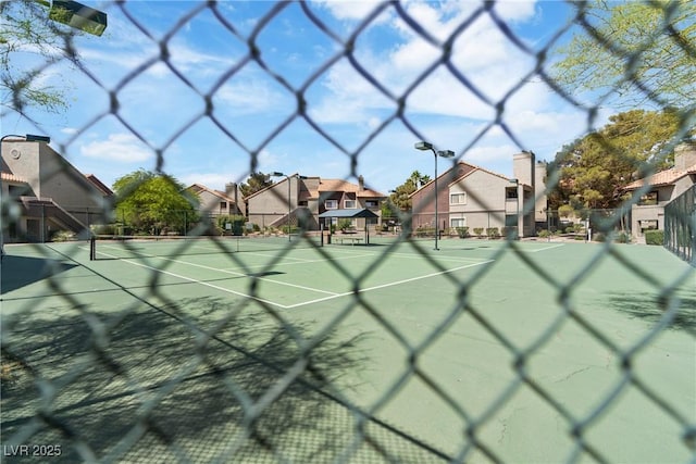 5038 S Rainbow Blvd Unit 206, Las Vegas, NV 89118 - view of tennis court with a residential view