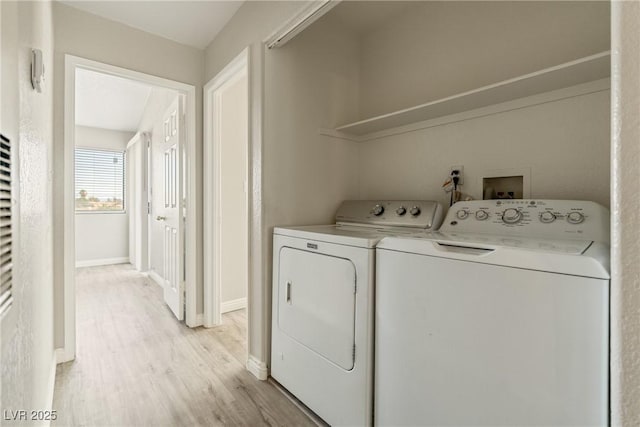 5038 S Rainbow Blvd Unit 206, Las Vegas, NV 89118 - laundry room with washing machine and clothes dryer and light wood-style floors
