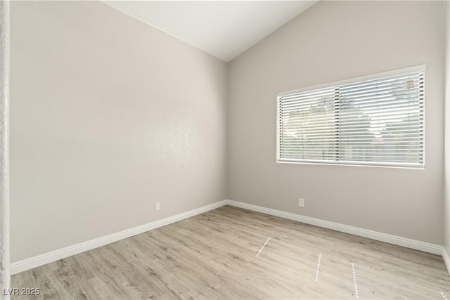 5038 S Rainbow Blvd Unit 206, Las Vegas, NV 89118 - unfurnished room featuring wood finished floors and lofted ceiling