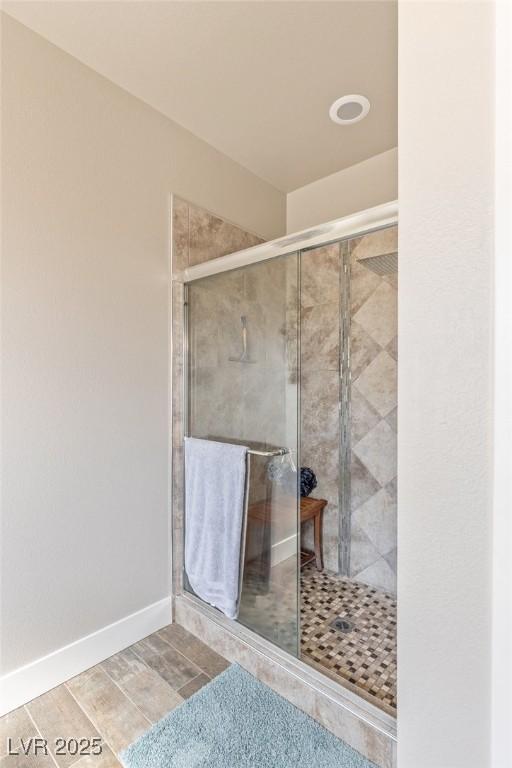 171 Weeping Willow Ct, Pahrump, NV 89048 - full bathroom featuring a stall shower and wood finished floors