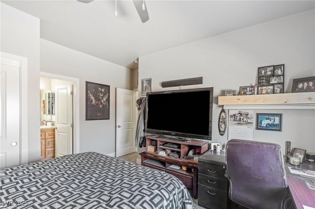 171 Weeping Willow Ct, Pahrump, NV 89048 - bedroom with connected bathroom, a ceiling fan, and a desk