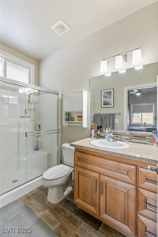 171 Weeping Willow Ct, Pahrump, NV 89048 - bathroom featuring a shower stall, vanity, and wood finished floors