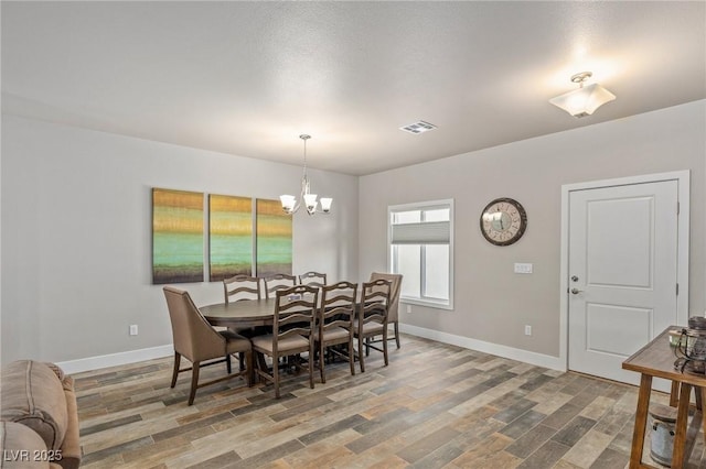 171 Weeping Willow Ct, Pahrump, NV 89048 - dining room with wood finished floors and a chandelier