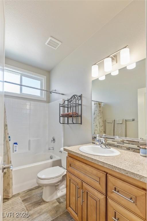 171 Weeping Willow Ct, Pahrump, NV 89048 - bathroom with vanity, shower / bathtub combination with curtain, and wood finished floors