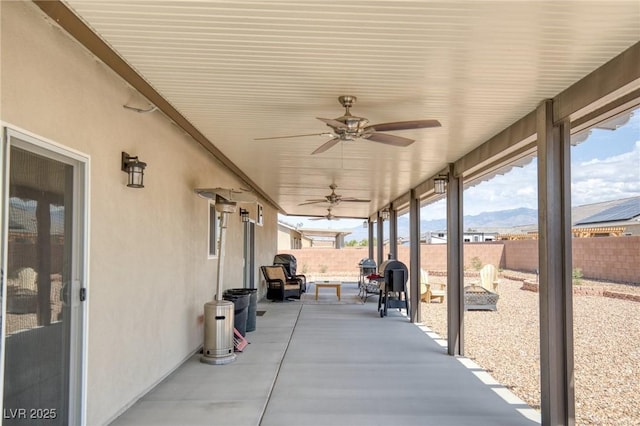 171 Weeping Willow Ct, Pahrump, NV 89048 - fenced backyard with a ceiling fan and a patio
