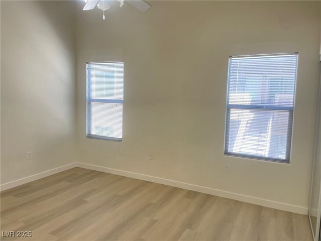 8985 S Durango Dr Unit 2043, Las Vegas, NV 89113 - unfurnished room with light wood-style floors, plenty of natural light, and a ceiling fan
