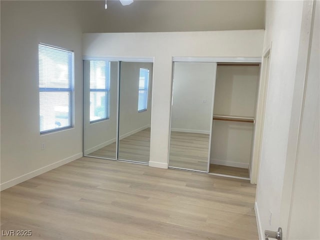 8985 S Durango Dr Unit 2043, Las Vegas, NV 89113 - unfurnished bedroom with multiple closets and light wood finished floors