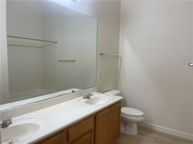 8985 S Durango Dr Unit 2043, Las Vegas, NV 89113 - full bath featuring double vanity, wood finished floors, and tub / shower combination