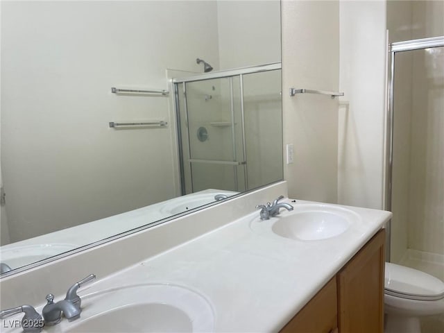 8985 S Durango Dr Unit 2043, Las Vegas, NV 89113 - bathroom with a shower stall and double vanity