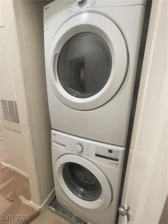 8985 S Durango Dr Unit 2043, Las Vegas, NV 89113 - laundry room featuring stacked washer / dryer