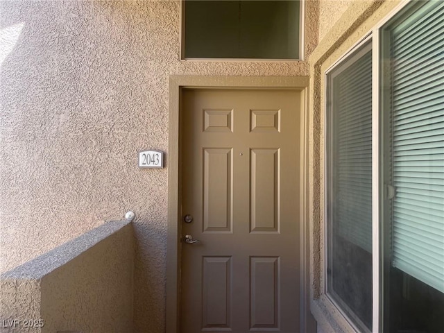 8985 S Durango Dr Unit 2043, Las Vegas, NV 89113 - view of exterior entry featuring stucco siding