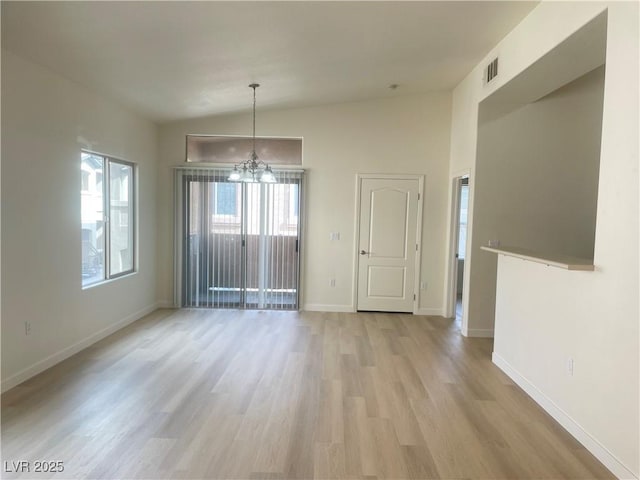 8985 S Durango Dr Unit 2043, Las Vegas, NV 89113 - spare room with a chandelier, light wood-style flooring, and lofted ceiling