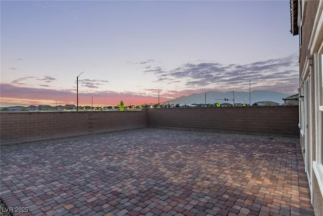6909 Toll Mountain St, North Las Vegas, NV 89086 - fenced backyard with a patio