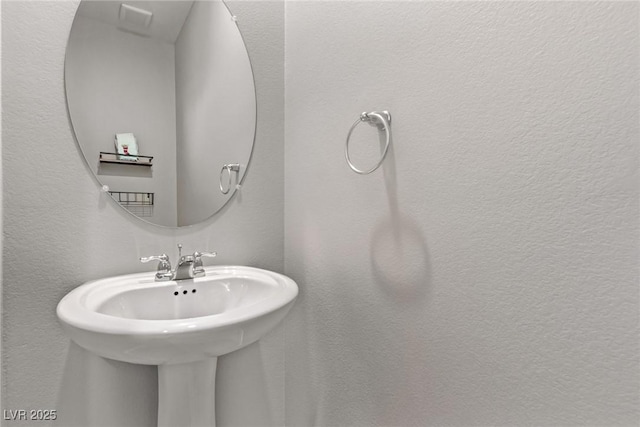 6909 Toll Mountain St, North Las Vegas, NV 89086 - bathroom featuring a sink and a textured wall