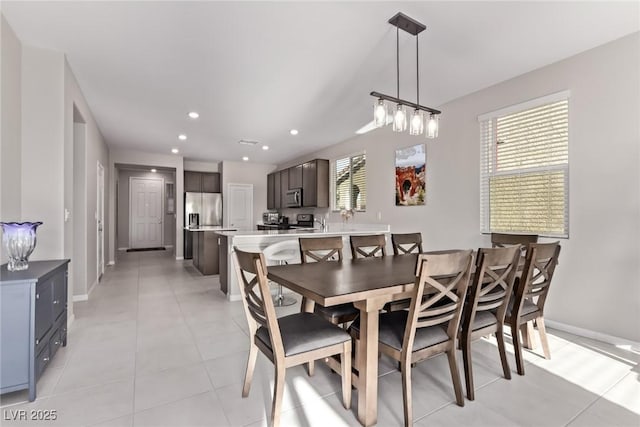 6909 Toll Mountain St, North Las Vegas, NV 89086 - dining area with recessed lighting and light tile patterned floors