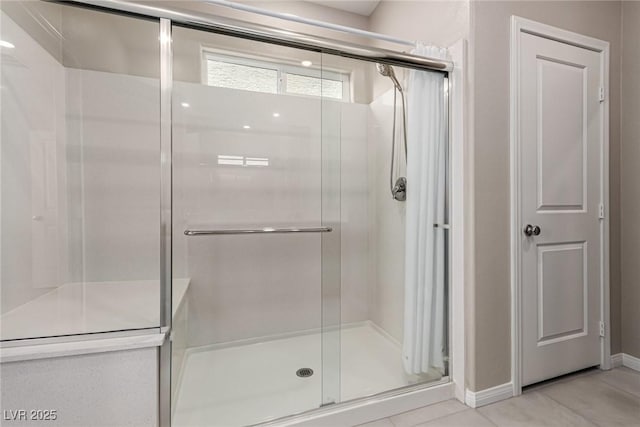 6909 Toll Mountain St, North Las Vegas, NV 89086 - bathroom with a stall shower and tile patterned flooring
