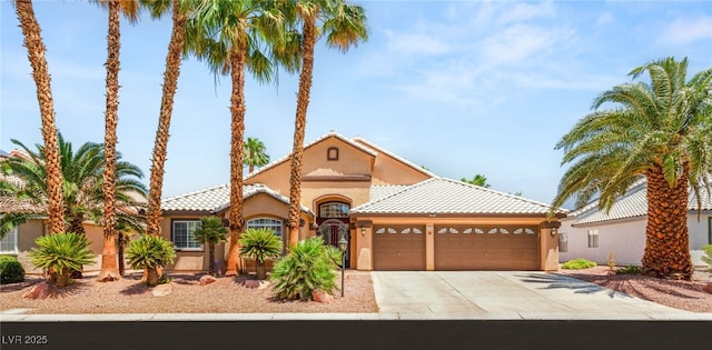 286 Bowsprit Ct, Las Vegas, NV 89183 - mediterranean / spanish-style home featuring a garage, driveway, stucco siding, and a tile roof