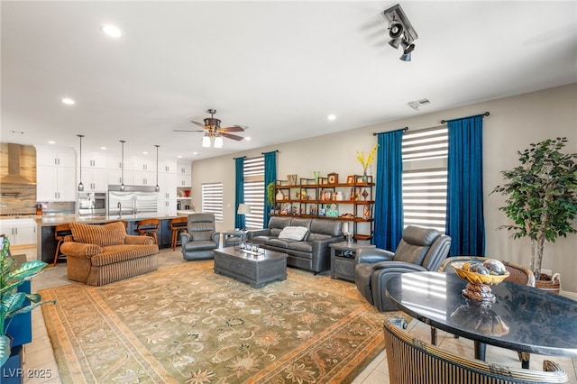 286 Bowsprit Ct, Las Vegas, NV 89183 - living area featuring plenty of natural light, a ceiling fan, light tile patterned floors, and recessed lighting