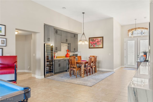 286 Bowsprit Ct, Las Vegas, NV 89183 - dining area with beverage cooler and a chandelier