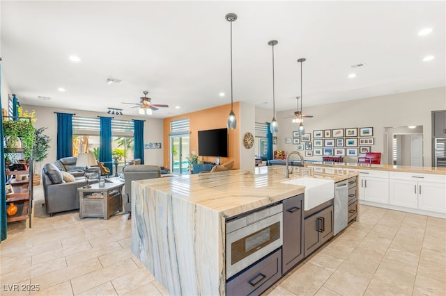286 Bowsprit Ct, Las Vegas, NV 89183 - kitchen with ceiling fan, open floor plan, appliances with stainless steel finishes, recessed lighting, and a spacious island