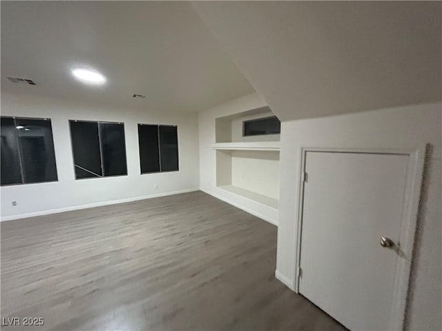 6412 Point Break St, North Las Vegas, NV 89084 - additional living space with wood finished floors and built in shelves