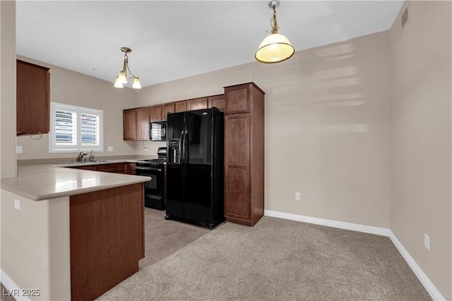 2291 W Horizon Ridge Parkway Unit 6131, Henderson, NV 89052 - kitchen featuring black appliances, a peninsula, light countertops, and pendant lighting