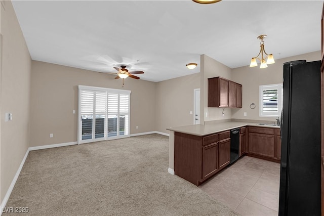 2291 W Horizon Ridge Parkway Unit 6131, Henderson, NV 89052 - kitchen featuring black appliances, a ceiling fan, a peninsula, light countertops, and open floor plan