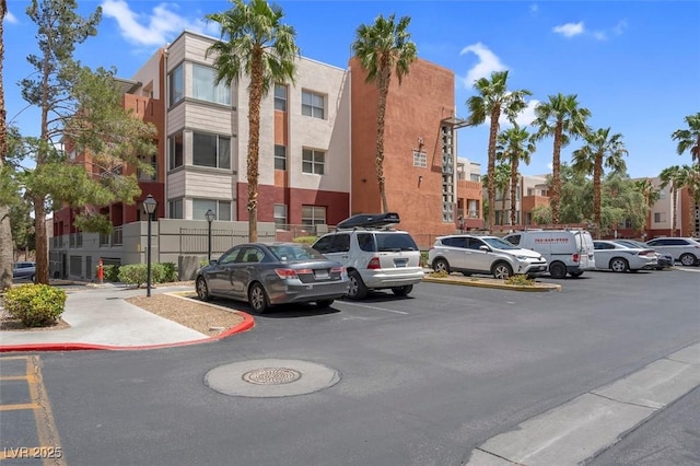 75 E Agate Ave Unit 206, Las Vegas, NV 89123 - view of property featuring uncovered parking and a residential view